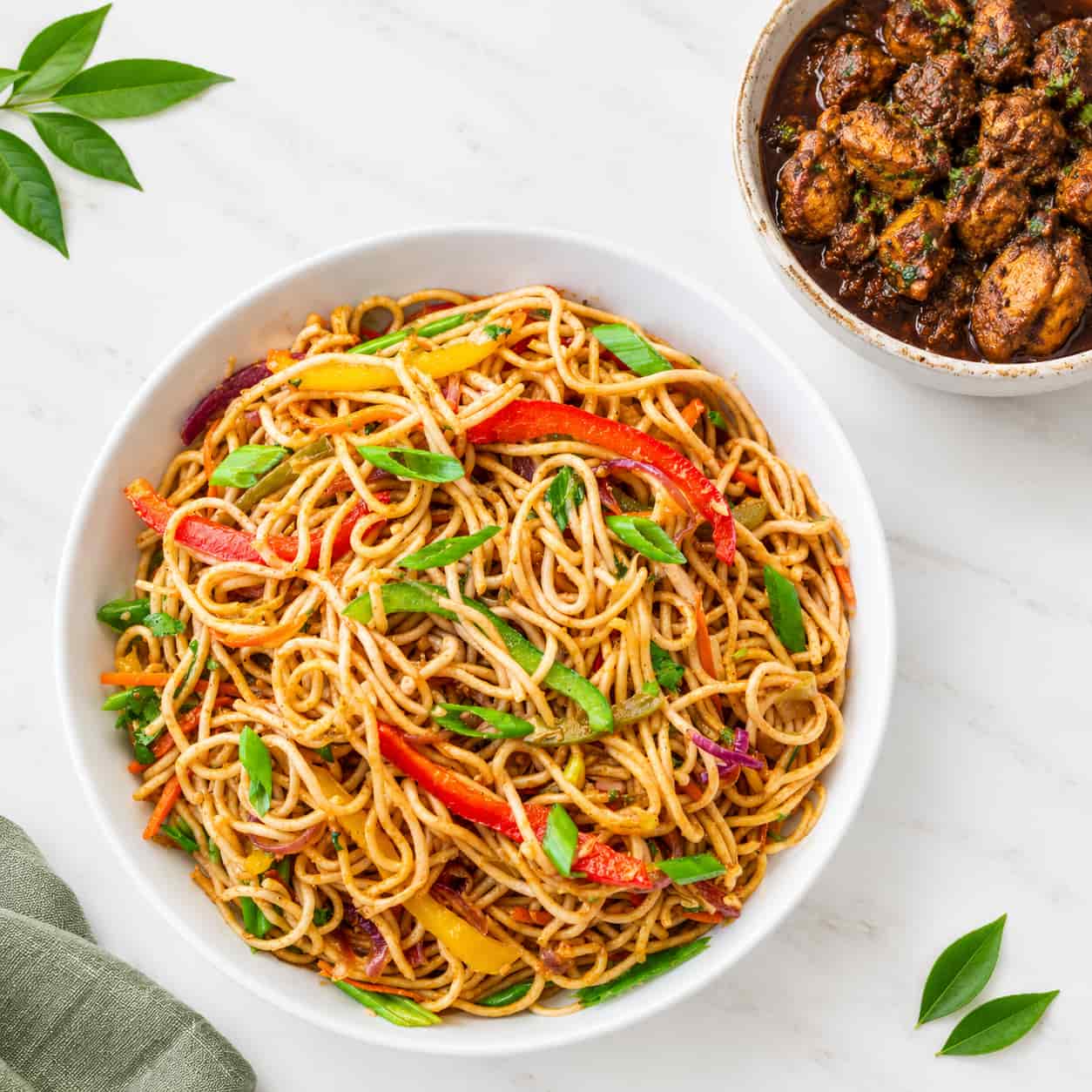 Stir-frying noodles in a wok